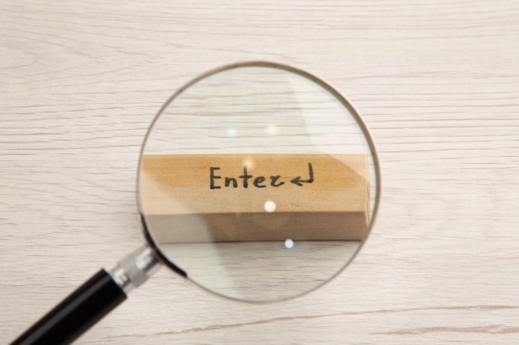 top view lupa on enter icon on wooden table